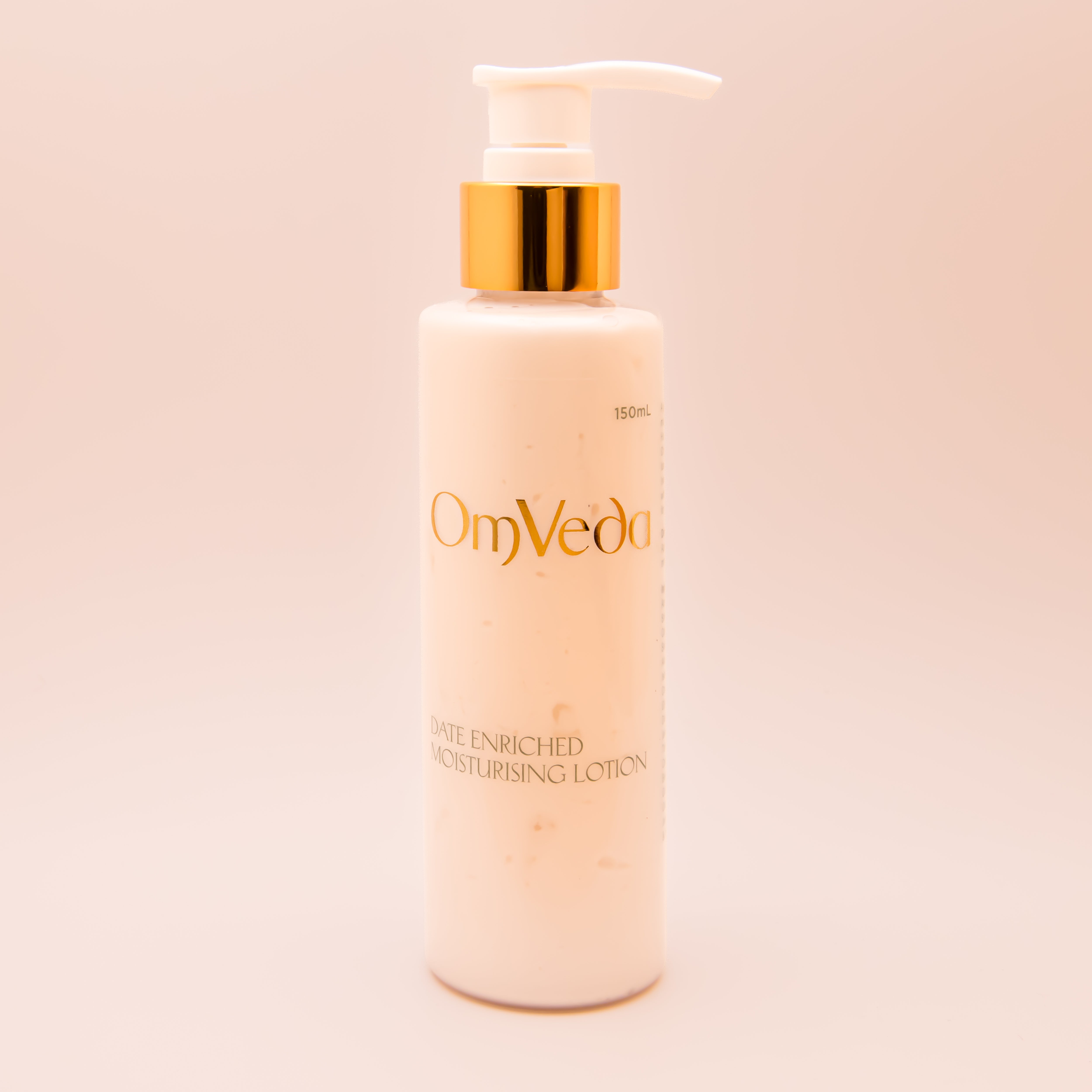 OmVeda date-enriched moisturizing lotion bottle with gold pump, 150 ml