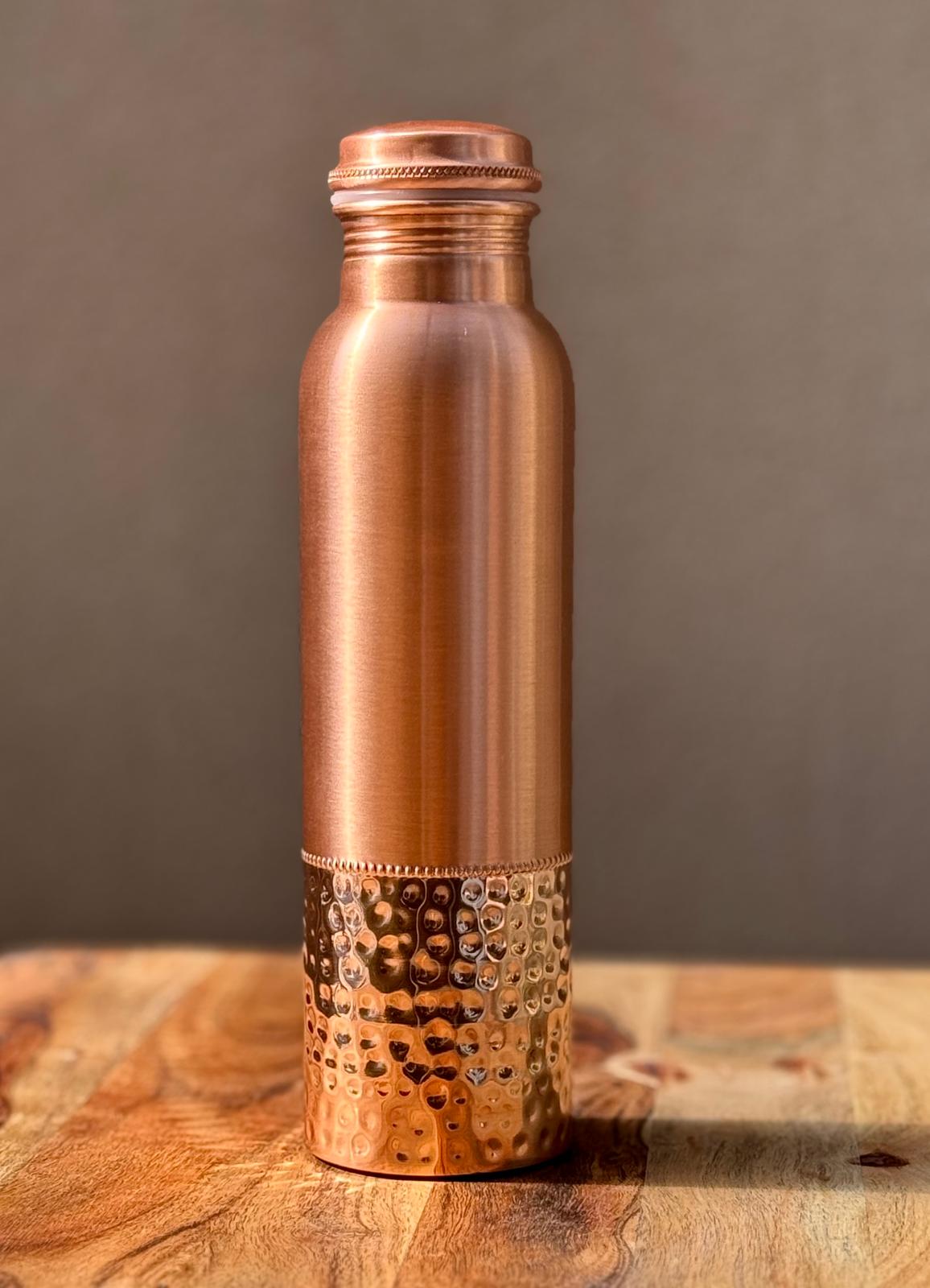 OmAyur copper water bottle with ridged cap and textured lower metal grip