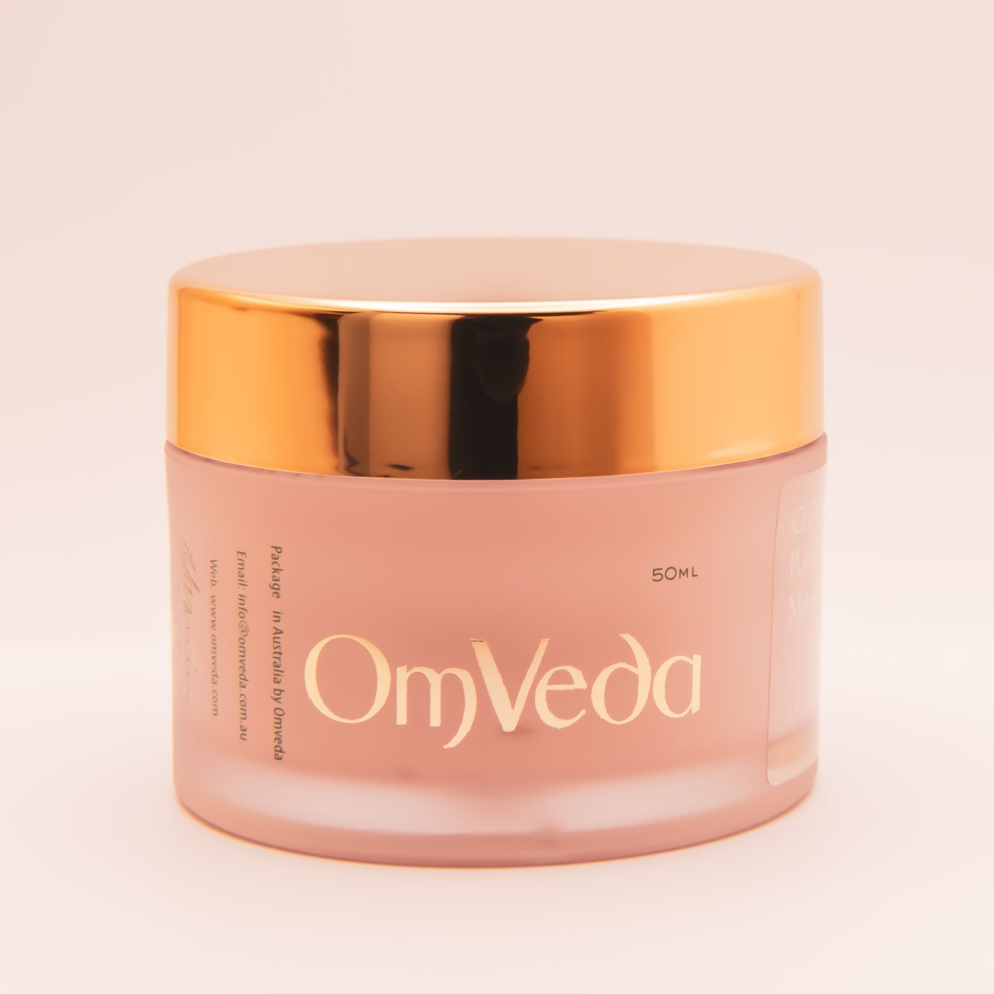OmVeda Clove Purifying Mask jar front view, gold lid and pale pink body, 50 ml