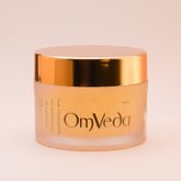 OmVeda Golden Glow treatment gel jar with peach body and gold lid