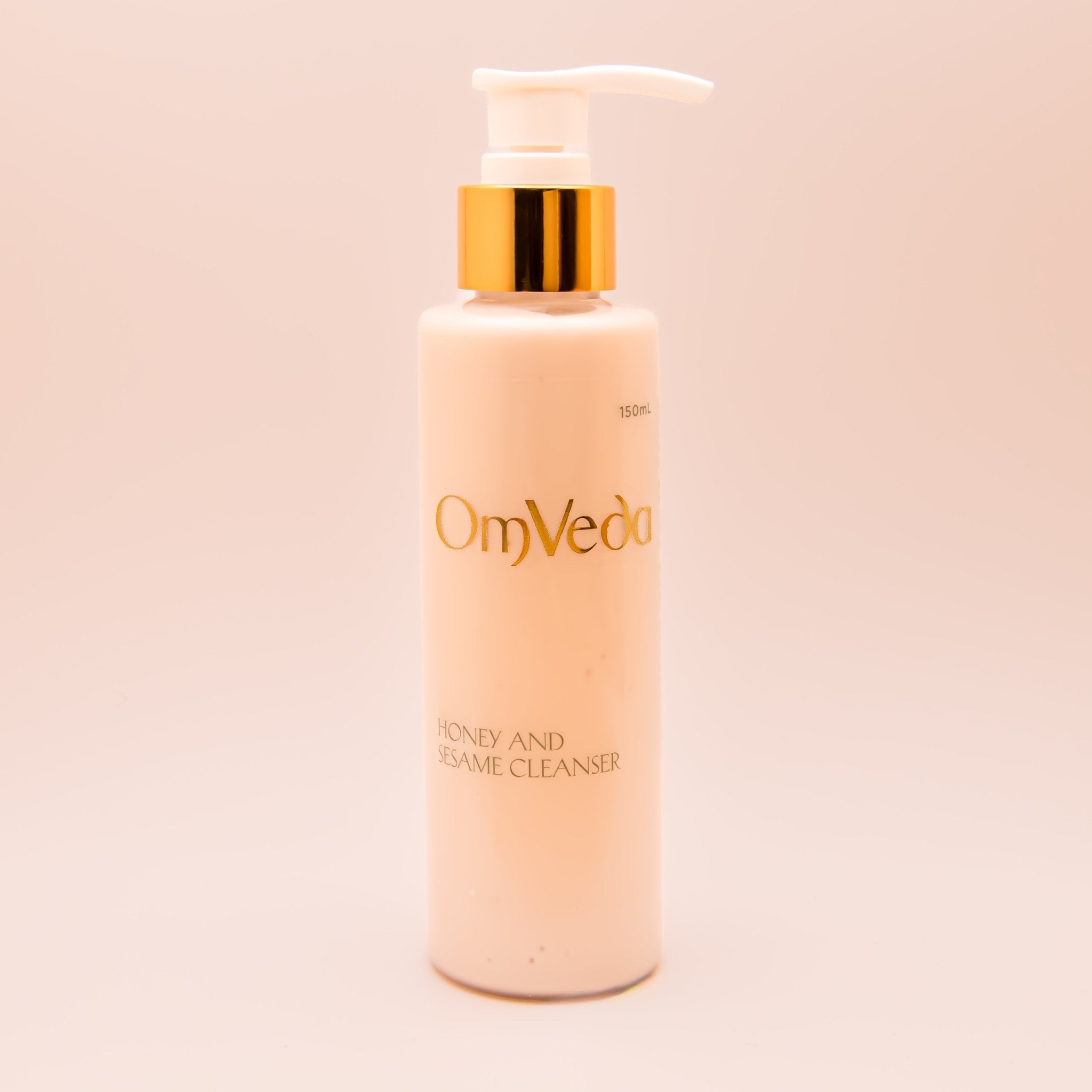 OmVeda Honey and Sesame Cleanser 150ml pump bottle with gold dispenser