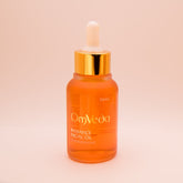 OmVeda Radiance Kumkumadi Facial Oil 50ml amber bottle with white dropper and gold cap.