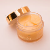 OmVeda Radiance overnight balm jar with creamy balm inside and gold lid