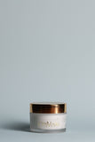 Rose nectar moisturiser jar with OmVeda label and gold lid