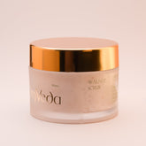 OmVeda walnut scrub jar with gold lid, cream jar showing side label