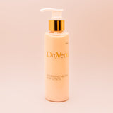 Body lotion bottle with pump; beige bottle and gold-toned cap