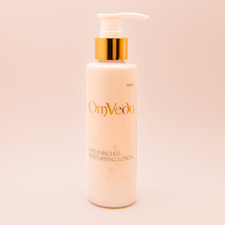 OmVeda date-enriched moisturizing lotion bottle with gold pump, 150 ml