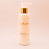 OmVeda date-enriched moisturizing lotion bottle with gold pump, 150 ml