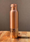 OmAyur copper water bottle with ridged cap and textured lower metal grip