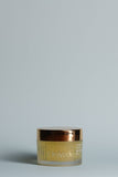 OmVeda Golden Glow treatment gel jar with gold lid