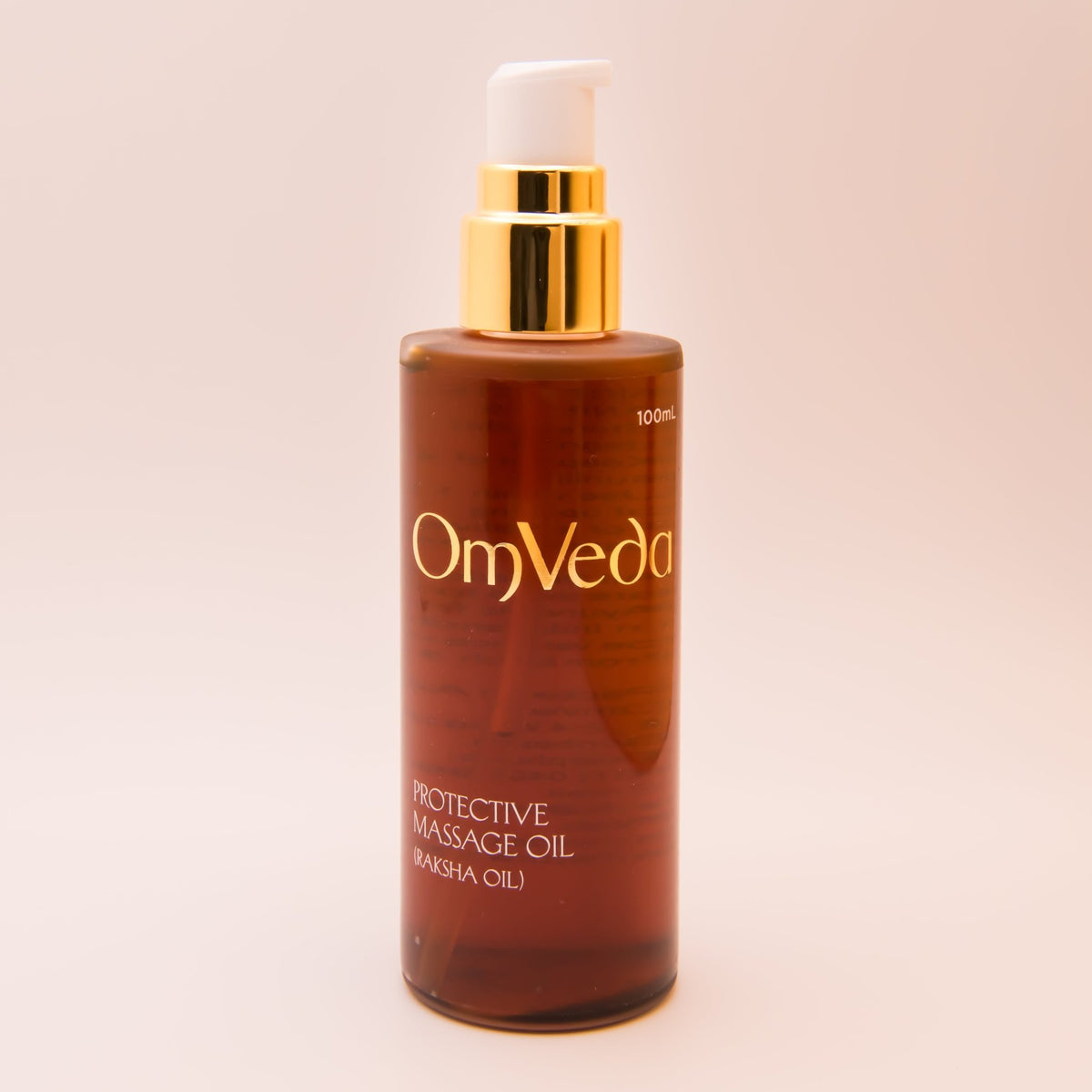 Protective body oil, 100 ml amber bottle with gold pump and OmVeda branding