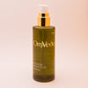 OmVeda recovery body oil 100 ml bottle with gold pump and amber-green liquid